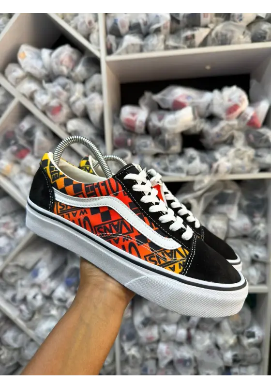 Flame vans in black, orange, and true white suede and canvas