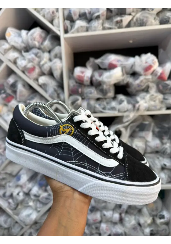 Spider Web sneakers in a black, white, and yellow colorway